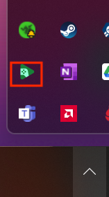 Screenshot der Taskleiste von Windows 11. Das Karottenbild ist ausgewählt, um ausgeblendete Symbole anzuzeigen, und ein rotes Quadrat wird um das Symbol 